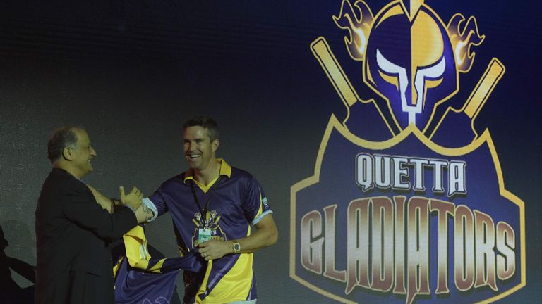 Pakistan Super League (PSL) team Quetta Gladiators, player Kevin Pietersen (R) takes team shirt during second edition of PSL draft in Dubai on October 19, 