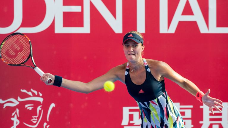 Kristina Mladenovic of France returns a shot against Australia's Daria Gavrilova at the Hong Kong Open