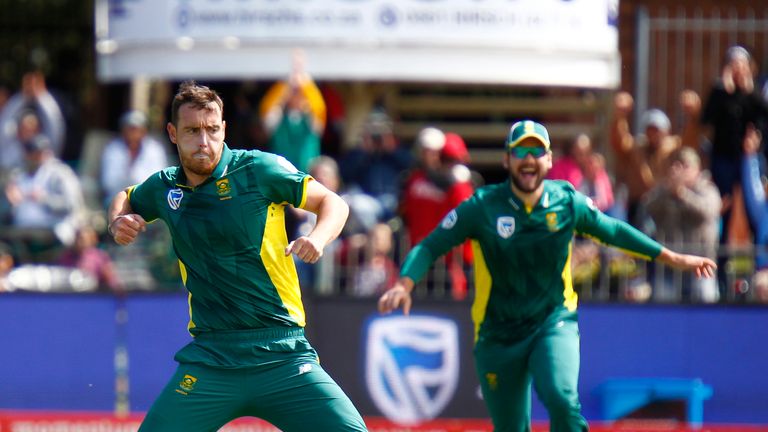 South Africa's bowler Kyle Abbott (L) celebrates taking the wicket of Australia's Aaron Finch (not pictured) during the fourth One Day International (ODI) 