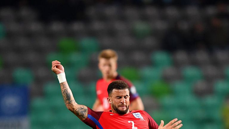 Kyle Walker of England battles for the ball with Jasmin Kurtic of Slovenia