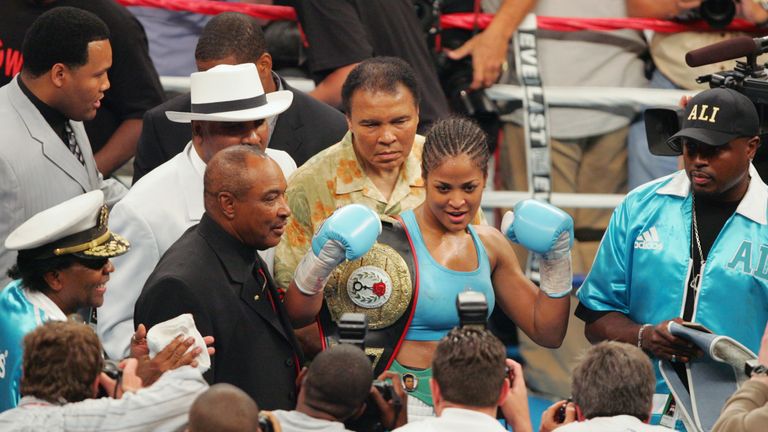 WASHINGTON - JUNE 11:  Laila Ali celebrates as her father, Muhammad Ali looks on following the WBC and WIBA Super Middleweight Title bout between Laila Ali