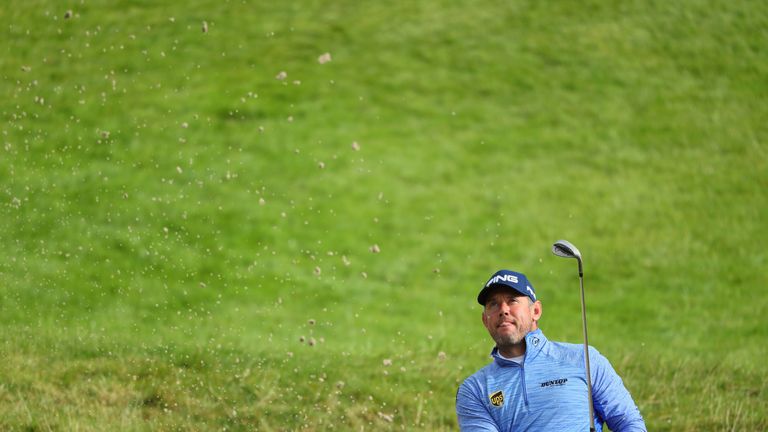 WATFORD, ENGLAND - OCTOBER 16:  Lee Westwood of England plays his second shot from a bunker on the first hole during the fourth round of the British Master