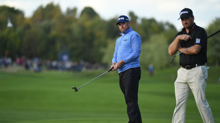 WATFORD, ENGLAND - OCTOBER 16:  Lee Westwood of England and  Graeme McDowell of Northern Ireland on the 15th green during the fourth round of the British M