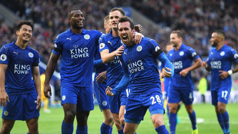 Christian Fuchs of Leicester celebrates with team-mates after scoring