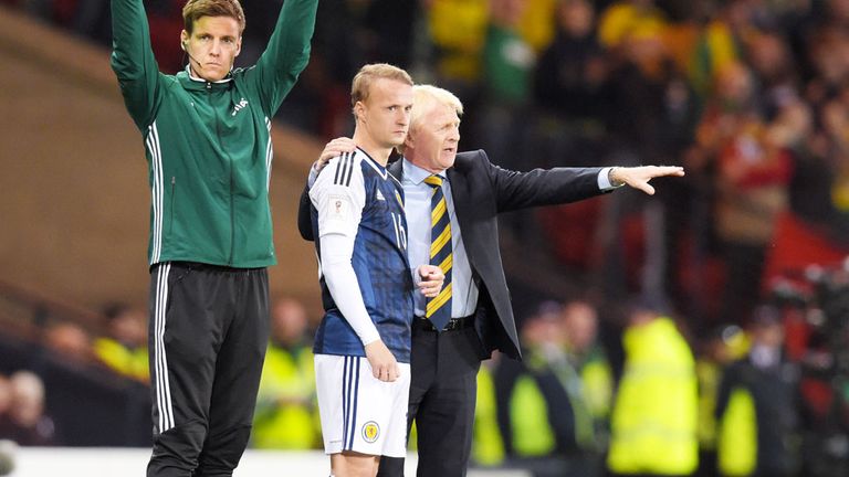 Scotland boss Gordon Strachan gives instructions to Leigh Griffiths as he prepares to come on as a substitute against Lithuania