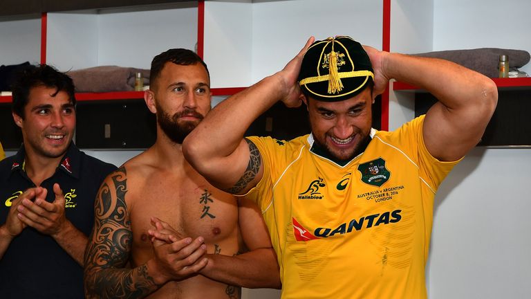 LONDON, ENGLAND - OCTOBER 08:  Leroy Houston of Australia puts on his debut cap at the end of The Rugby Championship match between Argentina and Australia 