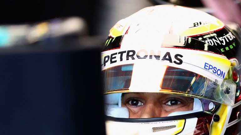 Lewis Hamilton sits in the Mercedes garage during final practice for the Japanese Grand Prix
