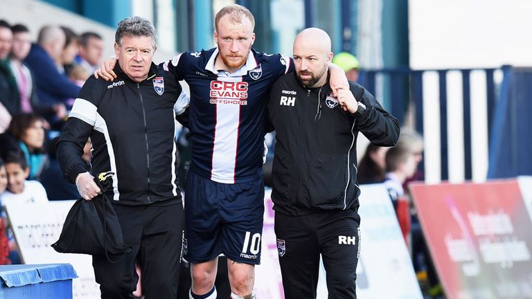 Ross County striker Liam Boyce leaves the pitch after suffering a knee injury against St Johnstone