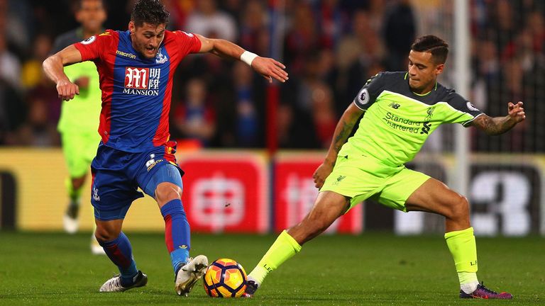 LONDON, ENGLAND - OCTOBER 29: Philippe Coutinho of Liverpool and Joel Ward of Crystal Palace compete for the ball during the Premier League match between C