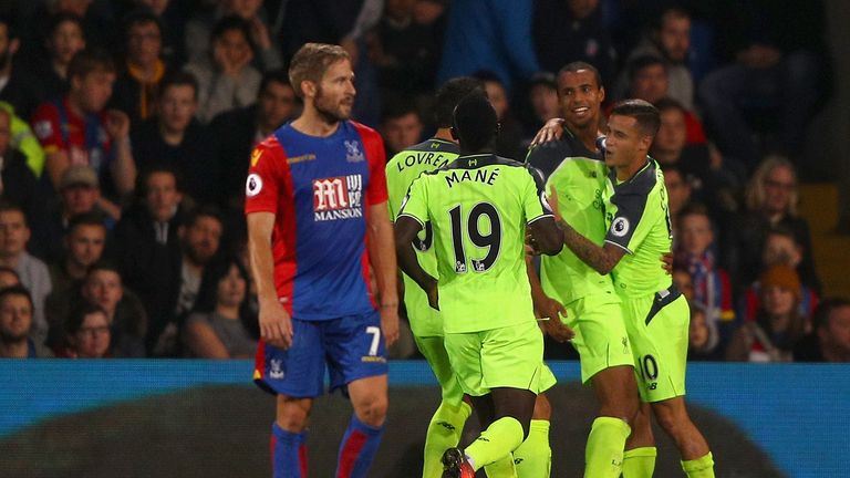 Joel Matip celebrates with team-mates