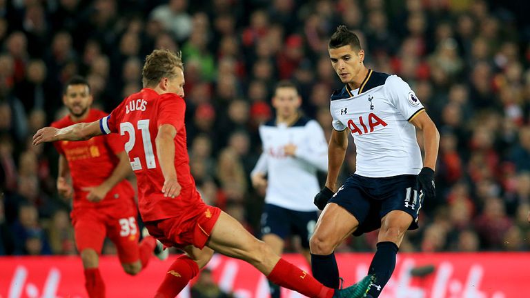 Lucas Leiva of Liverpool (L) tackles Erik Lamela of Tottenham Hotspur (R)