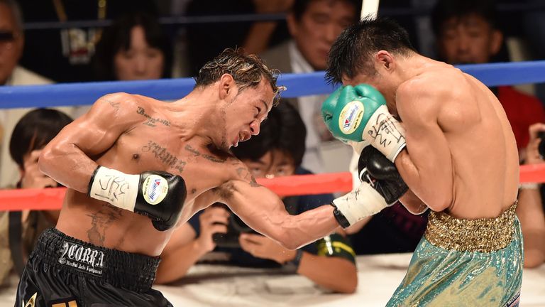 Luis Concepcion (L) and Japan's Kohei Kono fight during their WBA super-flyweight title