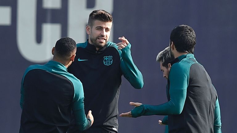 Barcelona's defender Gerard Pique (2ndL) speaks with teammates during a training session at the Sports Center FC Barcelona Joan Gamper in Sant Joan Despi, 