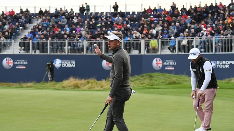 WATFORD, ENGLAND - OCTOBER 13:  Luke Donald of England acknowledges the fans after holing out on the 18th green during the first round of the British Maste