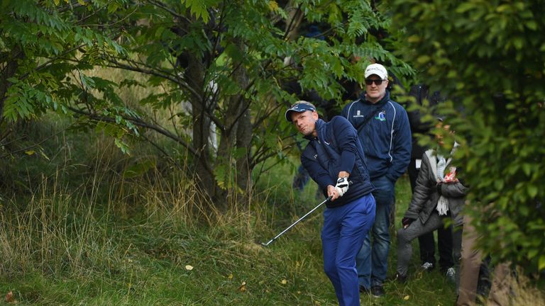 WATFORD, ENGLAND - OCTOBER 14:  Luke Donald of England plays his second shot on the 15th hole during the second round of the British Masters at The Grove o