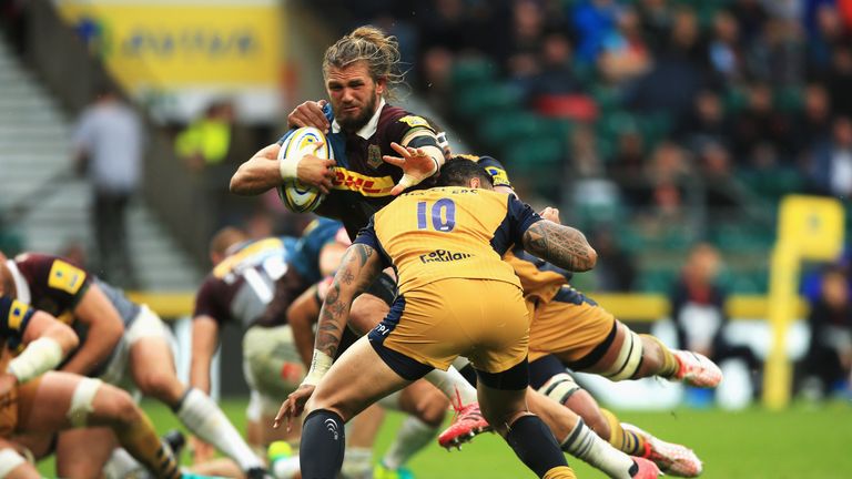 Luke Wallace of Harlequins is tackled by Tusi Pisi of Bristol 