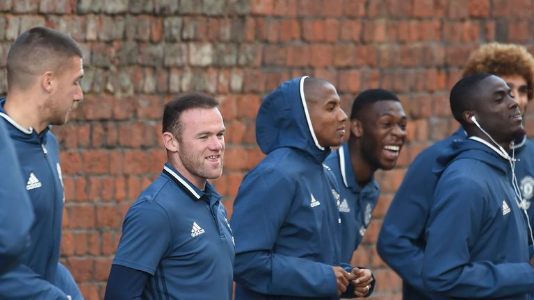 Manchester United squad warm up outside the Titanic Hotel before tonights game against Liverpool