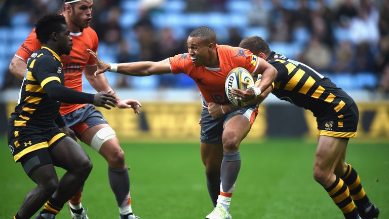 Christian Wade and Jimmy Gopperth of Wasps tackle Marcus Watson 