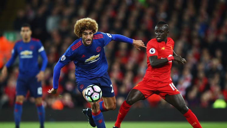 LIVERPOOL, ENGLAND - OCTOBER 17:  Sadio Mane of Liverpool challenges Marouane Fellaini of Manchester United during the Premier League match between Liverpo