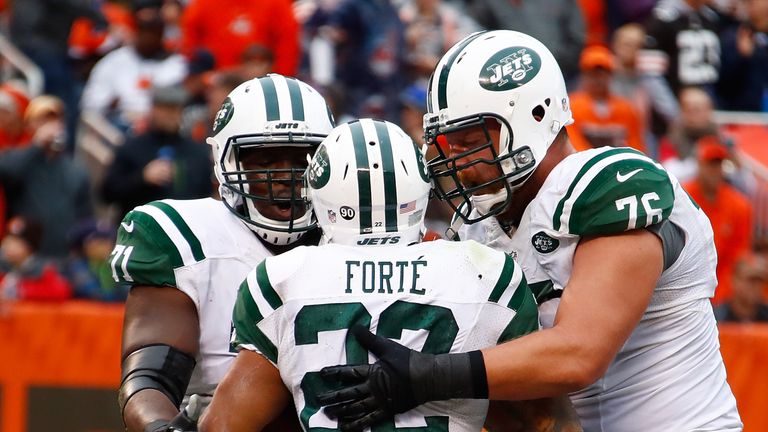 CLEVELAND, OH - OCTOBER 30:  Matt Forte #22 of the New York Jets celebrates his touchdown with Ben Ijalana #71 and Wesley Johnson #76 during the third quar