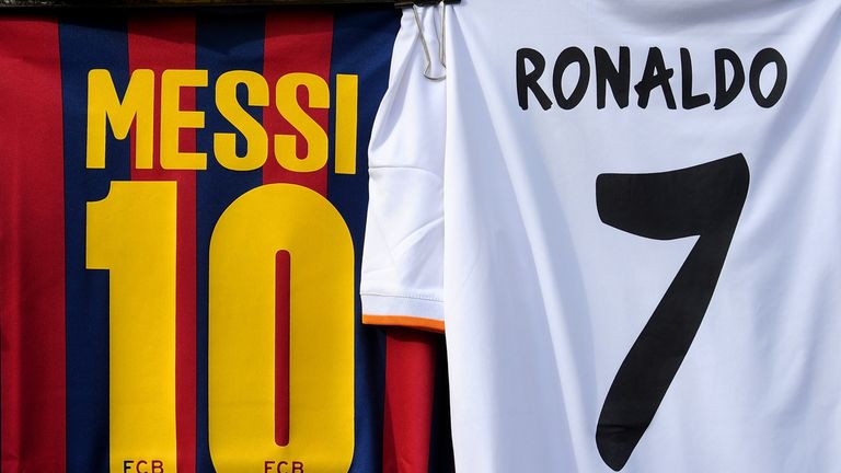 MADRID, SPAIN - MARCH 23:  Shirts bearing the names of Lionel Messi of FC Barcelona and Cristiano Ronaldo of Real Madrid CF are seen on display at a mercha