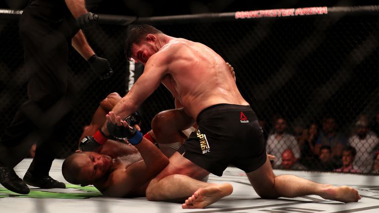 Michael Bisping (top) during his bout against Dan Henderson in the Middleweight Championship of the World of UFC 204 at Manchester Arena.