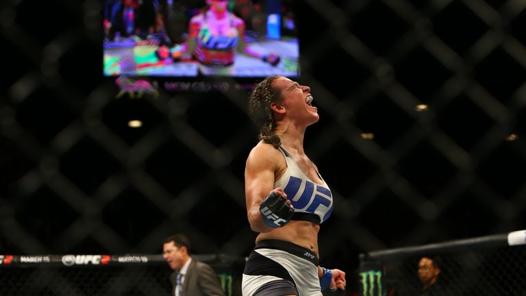 LAS VEGAS, NV - MARCH 5:  Miesha Tate celebrates after defeating UFC bantamweight champion Holly Holm during UFC 196 at the MGM Grand Garden Arena on March