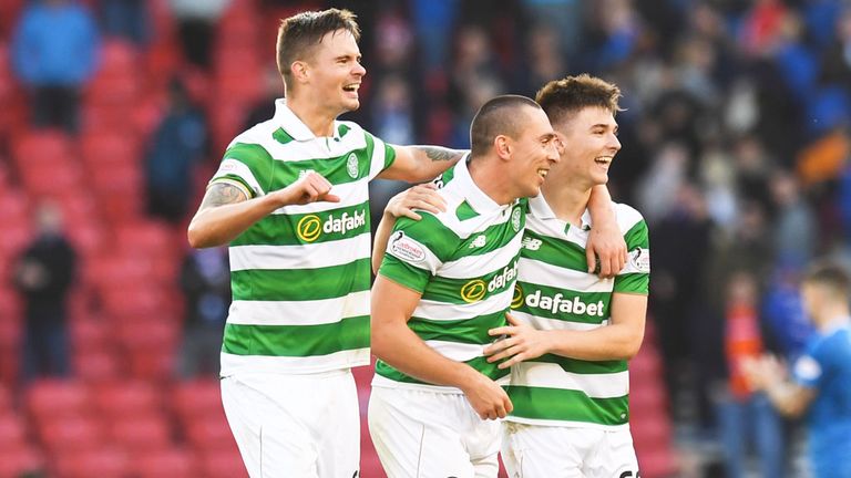 Mikael Lustig and Kieran Tierney (63) either side of Celtic skipper Scott Brown