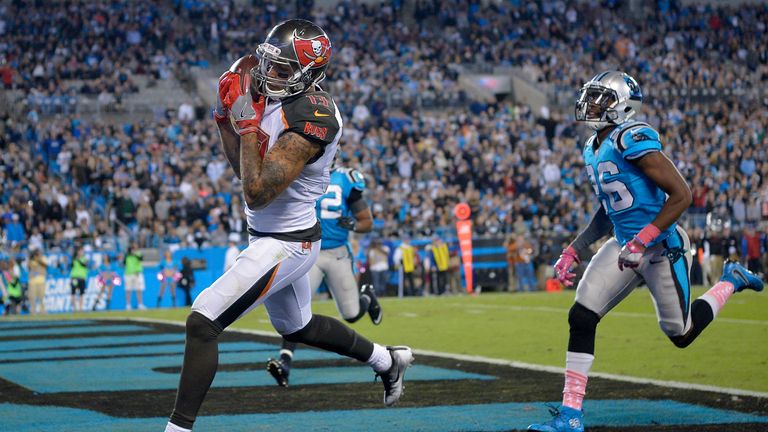 CHARLOTTE, NC - OCTOBER 10:  Mike Evans #13 of the Tampa Bay Buccaneers catches a touchdown pass against the Carolina Panthers in the 3rd quarter during th