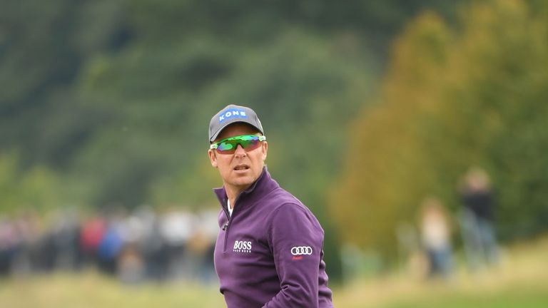 WATFORD, ENGLAND - OCTOBER 14:  Mikko Ilonen of Finland looks on after playing his second shot on the 18th hole during the second round of the British Mast