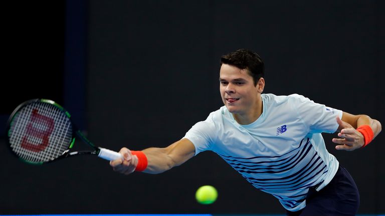 BEIJING, CHINA - OCTOBER 04:  Milos Raonic of Canada returns a shot against Florian Mayer of Germany during the Men's singles first round match on day four