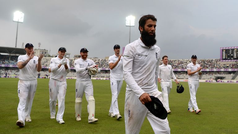 DHAKA, BANGLADESH - OCTOBER 28:  Moeen Ali of England leads his team from the field after taking five wickets during the first day of the 2nd Test match be