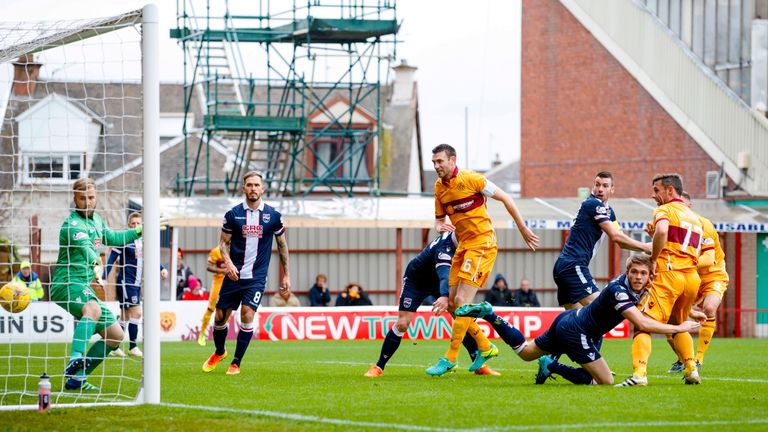 Motherwell's Scott McDonald (right) heads the home side in front