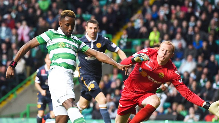 Celtic striker Moussa Dembele beats Motherwell 'keeper Craig Samson to the ball