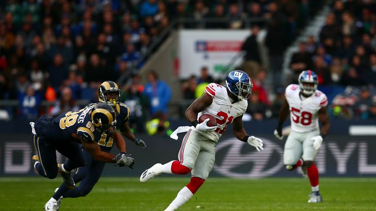 LONDON, ENGLAND - OCTOBER 23:  Landon Collins #21 of the New York Giants intercepts before scoring a touchdown during the NFL International series game bet