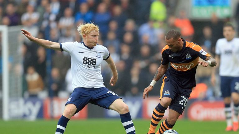 Preston's Ben Pringle (left) makes a challenge on Newcastle United's Yoan Gouffran 