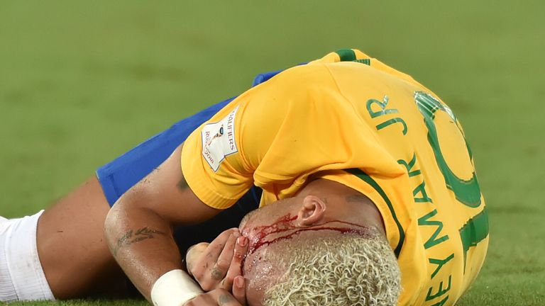 Brazil's Neymar gestures on the ground after receiving an elbow to the face by Bolivia's Yasmani Duk during the Russia 2018 World Cup football qualifier ma