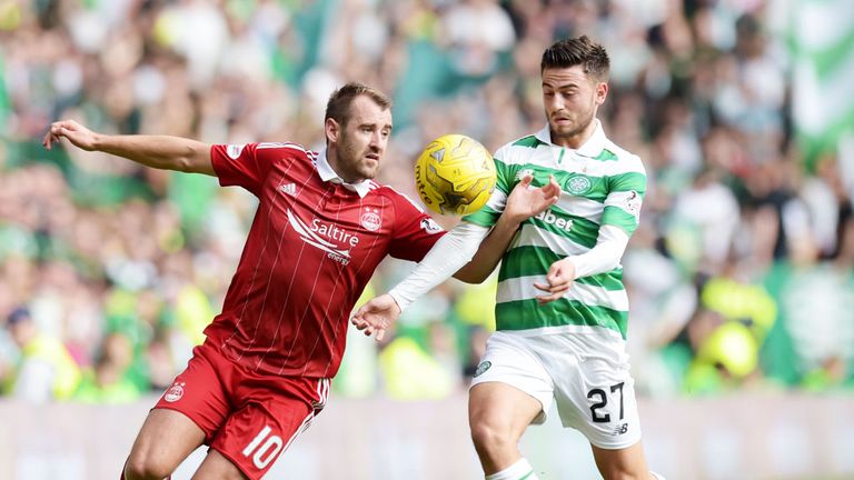 Aberdeen's Niall McGinn (left) and Patrick Roberts of Celtic compete for the ball