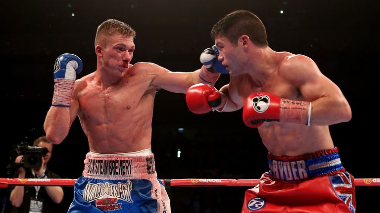 LONDON, ENGLAND - MAY 30:  Nick Blackwell of England lands a punch on John Ryder of England during their British Middleweight Championship fight at The O2 