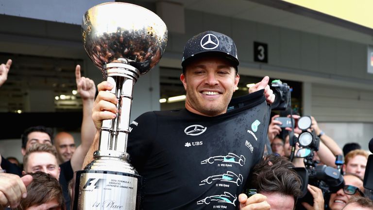 SUZUKA, JAPAN - OCTOBER 09: Nico Rosberg of Germany and Mercedes GP celebrates his win and the Mercedes team becoming the constructors champions for 2016 d