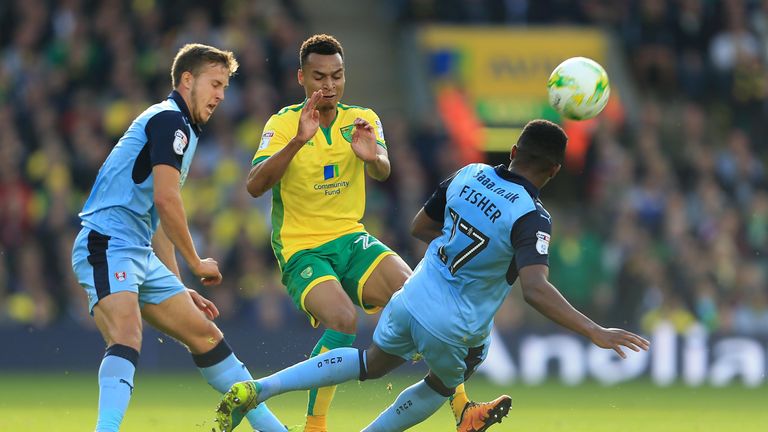 Jacob Murphy of Norwich and Darnell Fisher of Rotherham United compete for the ball 