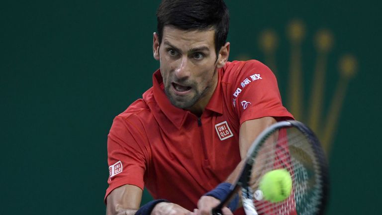Novak Djokovic of Serbia hits a return against Roberto Bautista Agut of Spain during their men's singles semi-finals match at the Shanghai Masters tennis t