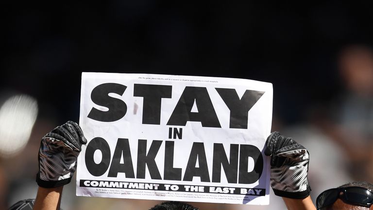 OAKLAND, CA - SEPTEMBER 18:  A fan holds a sign in the stands in reference to a potential move by the Oakland Raiders to Las Vegas during the NFL game betw