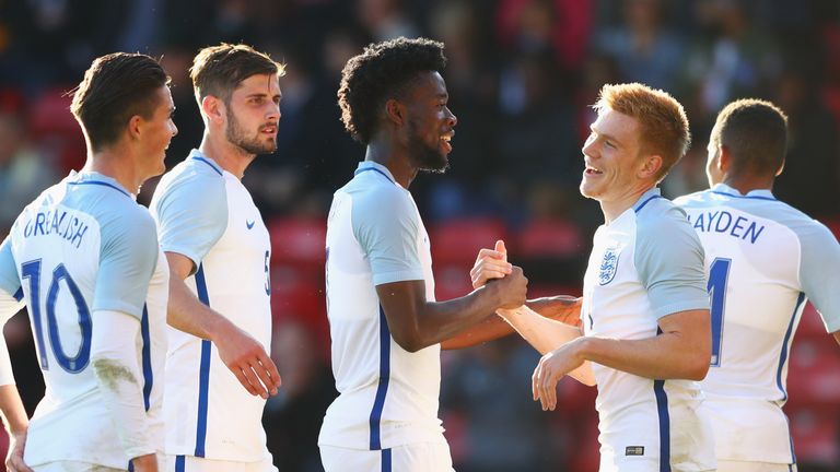 WALSALL, ENGLAND - OCTOBER 11:  Duncan Watmore of England U21 (11) celebrates with Josh Onomah and team mates as he scores their fourth goal during the UEF