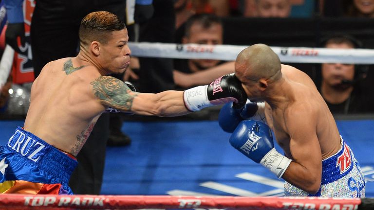 LAS VEGAS, NV - OCTOBER 12:  Orlando Cruz (L) hits Orlando Salido in the first round of their WBO featherweight championship bout at the Thomas & Mack Cent