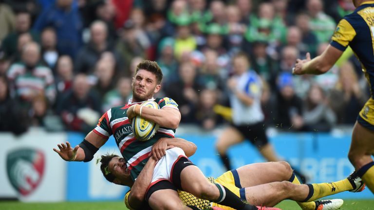 Owen Williams of Leicester is tackled by Worcester's Dean Hammond