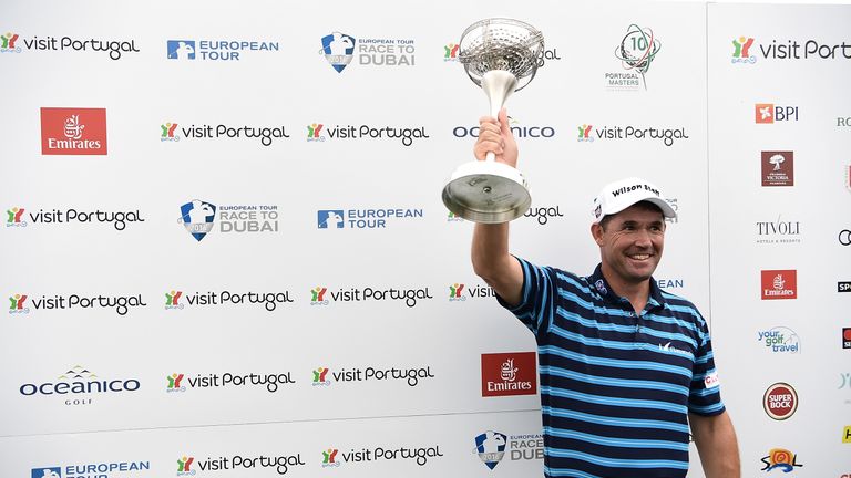 Padraig Harrington poses with the trophy following his victory at the Portugal Masters