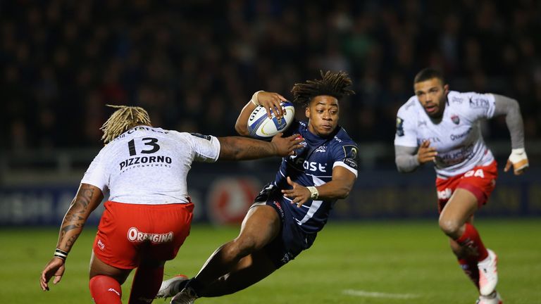 SALFORD, ENGLAND - OCTOBER 21:  Paolo Odogwu of Sale Sharks runs at Mathieu Bastareaud of RC Toulon during the European Rugby Champions Cup match between S