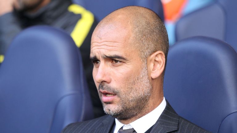 Manchester City manager Pep Guardiola looks on