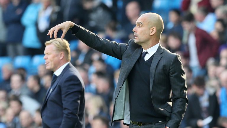 Manchester City manager Pep Guardiola (right) gestures